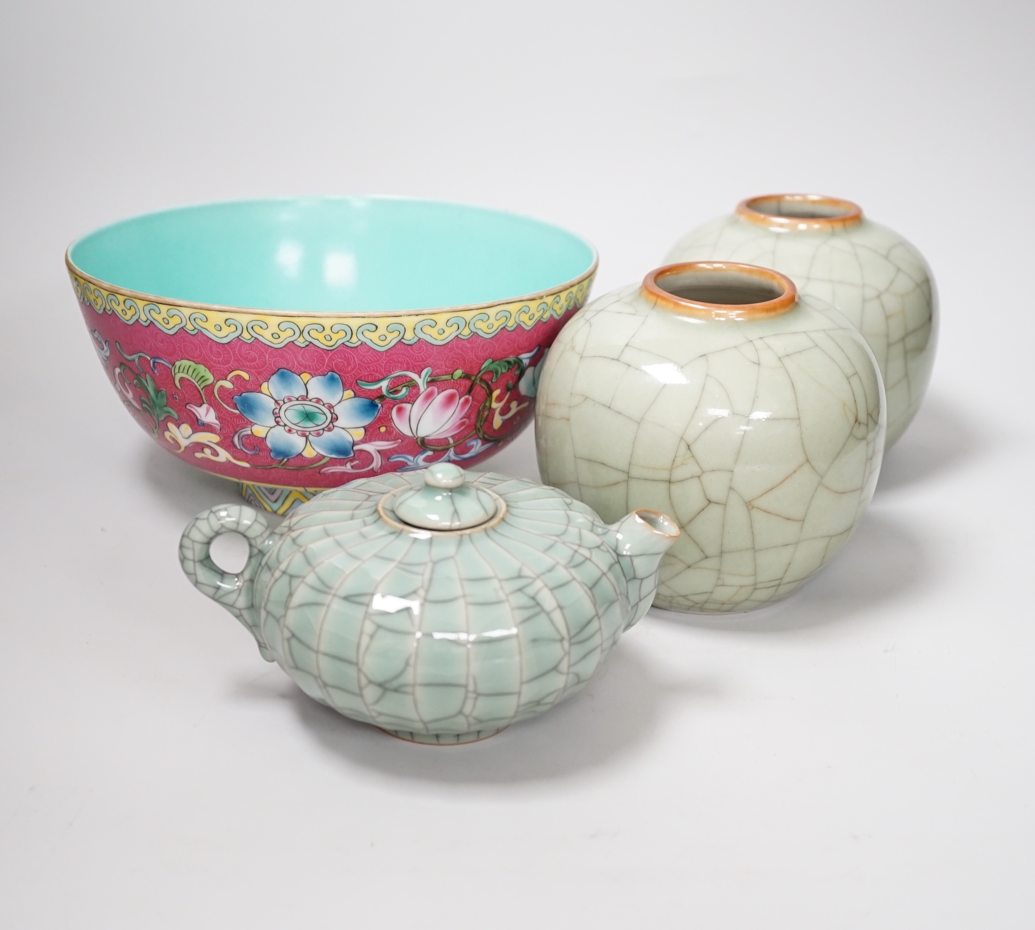 A Chinese enamelled bowl, a pair of celadon jars and a Chinese wine pot, tallest 12.5cm